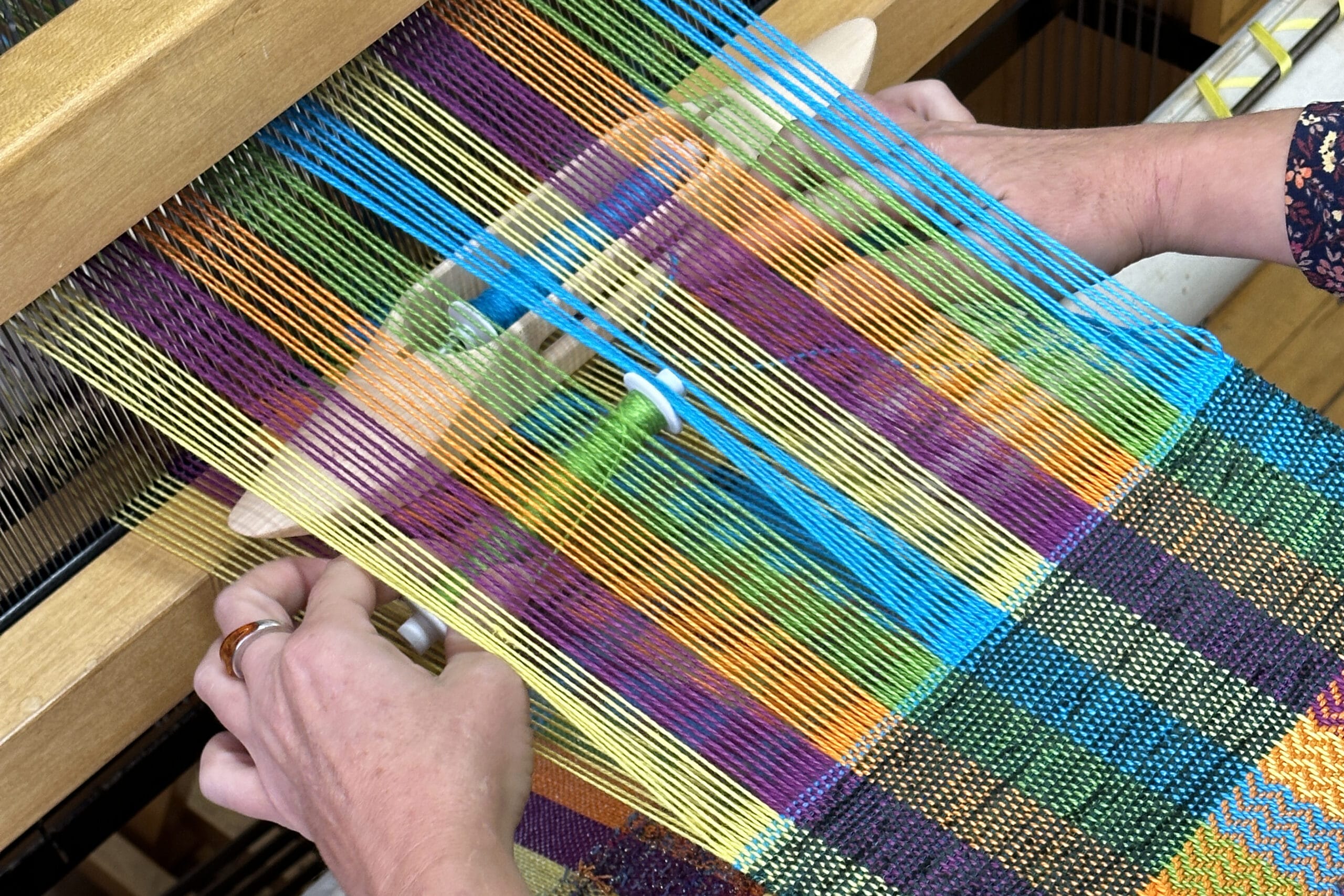 A closeup of someone weaving