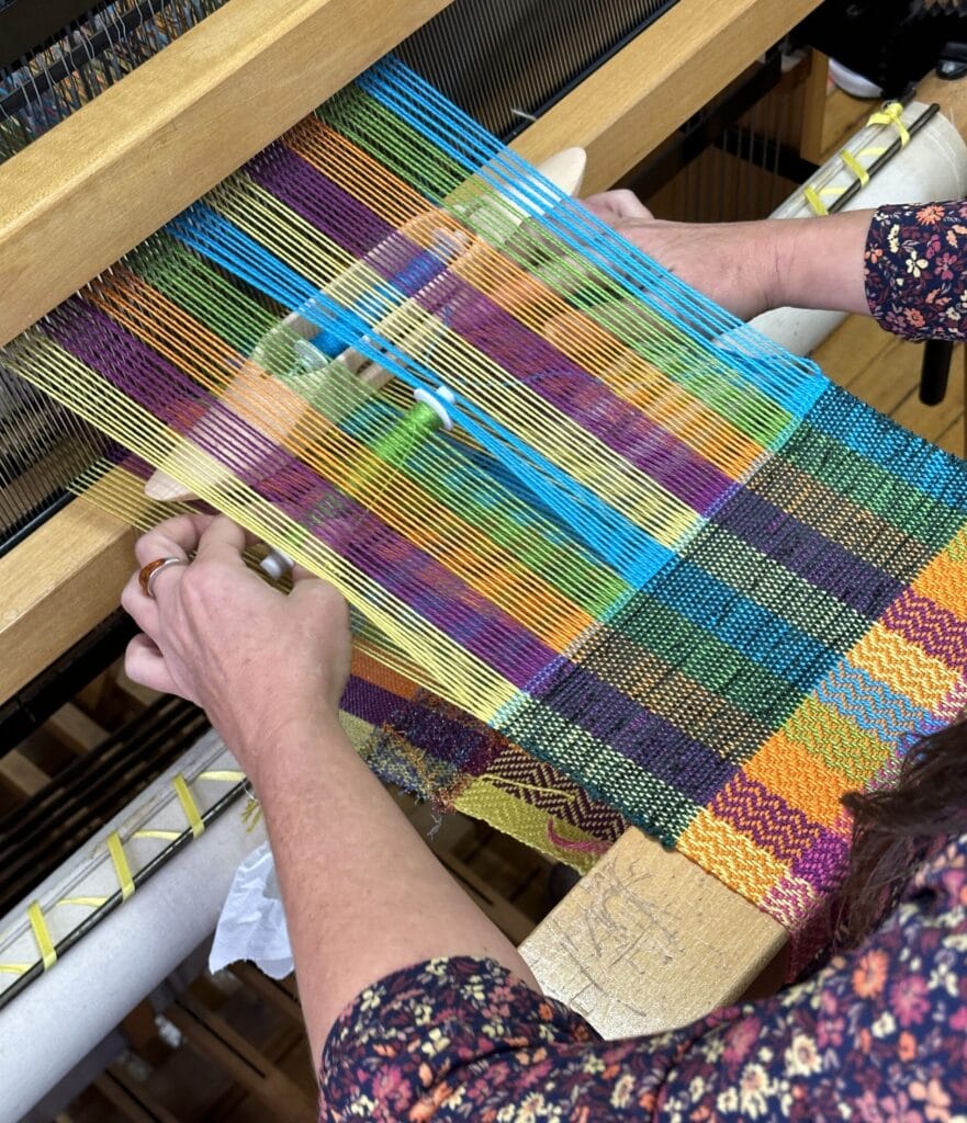 A closeup of someone weaving