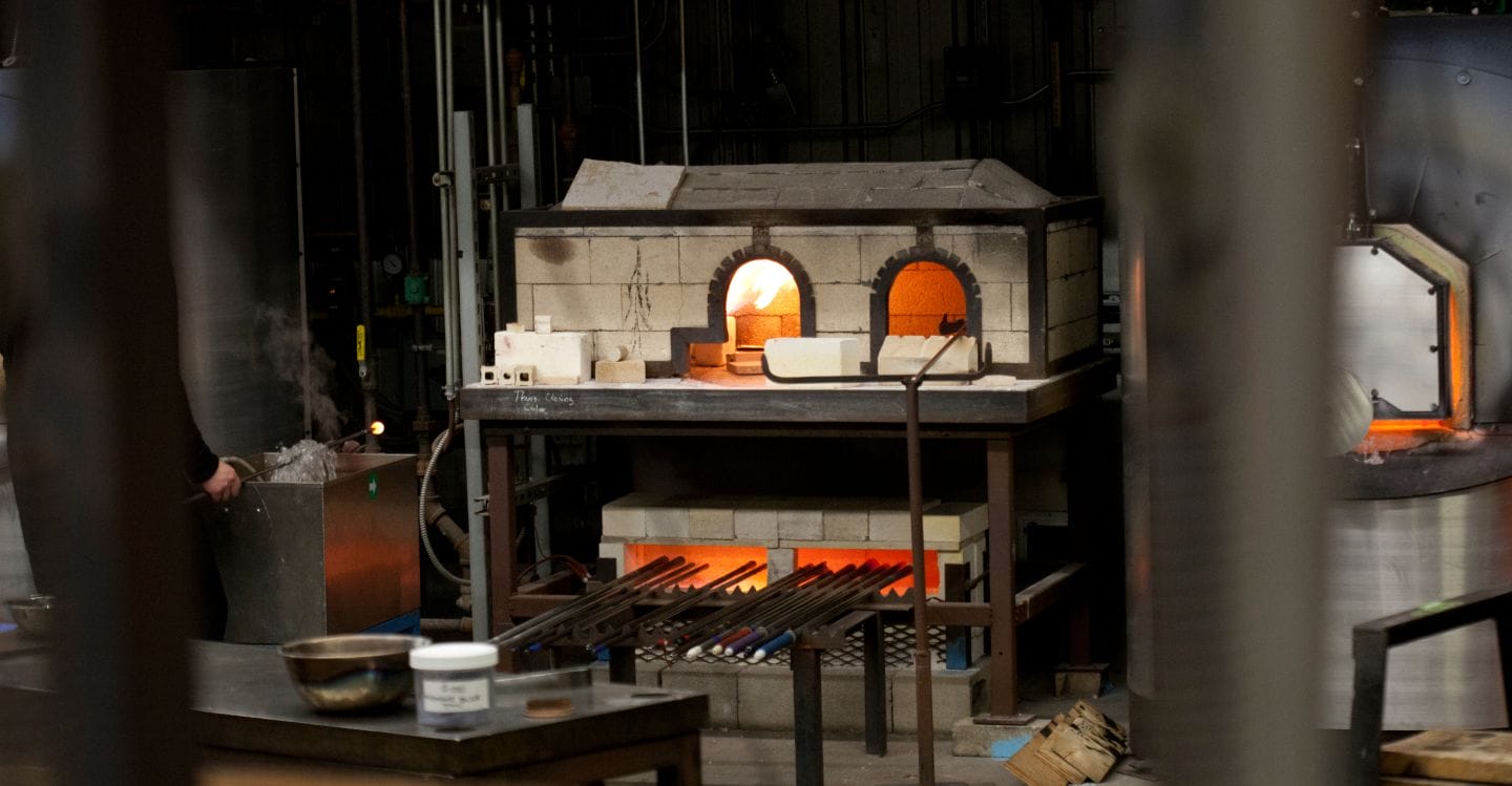 Baking clay or other materials in the owen that is found at MassArt.