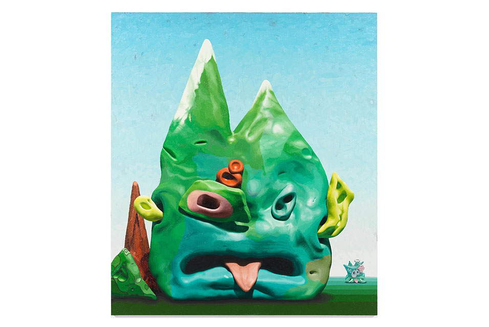 A surreal painting by Alexander Ross, displayed at the Miles McEnery Gallery, features a green, blob-like creature resembling a mountain with facial features. Its eyes and tongue-out mouth stand out against a backdrop of a smaller figure and simple landscape under a blue sky.