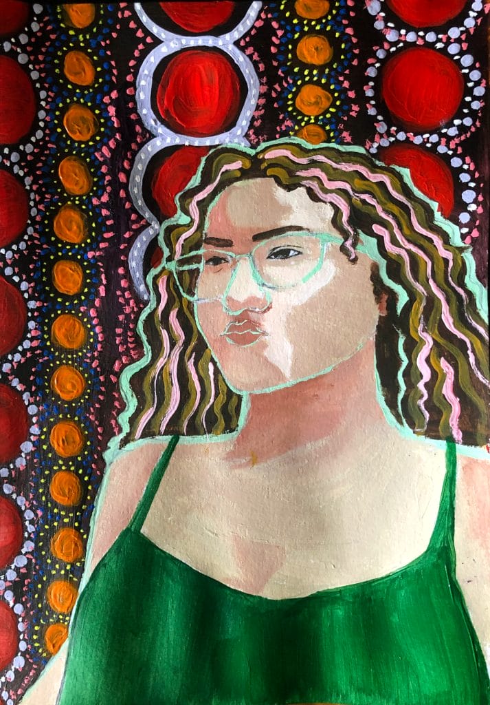 This self-portrait showcases a person with wavy hair and glasses in a green top. The background bursts with colorful circular patterns adorned with red, orange, and white dots, forming a vibrant and abstract design.