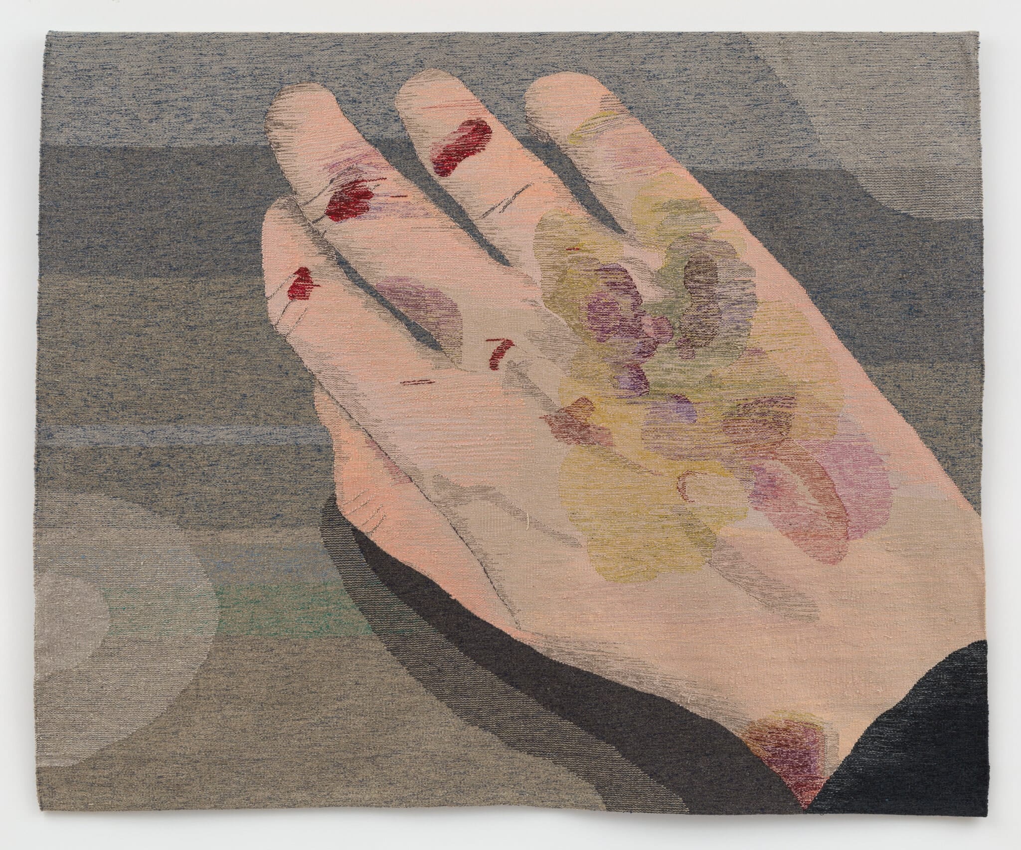 A tapestry in the art gallery depicts a close-up of a hand adorned with abstract floral patterns. The background features muted, earthy tones, enhancing the focus on the intricate details of the hand and flowers, making it a centerpiece in contemporary exhibitions.