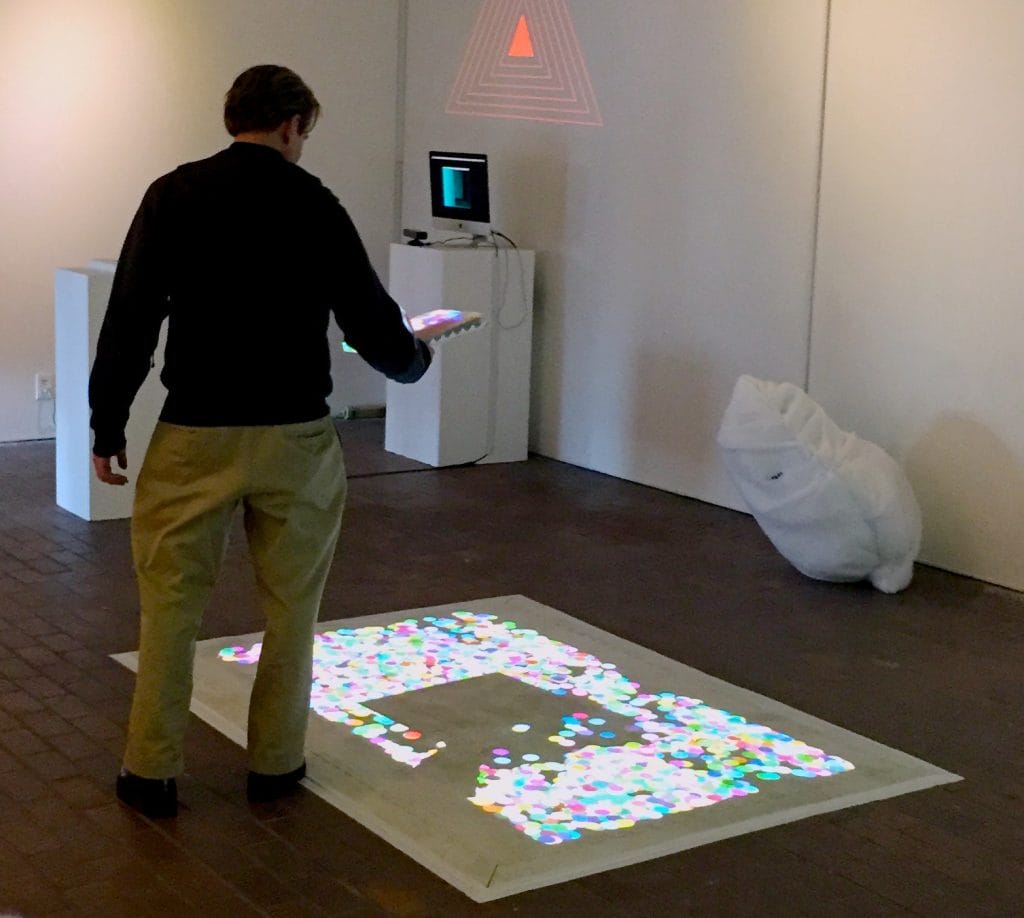 A projection of a digital interactive ball pit.