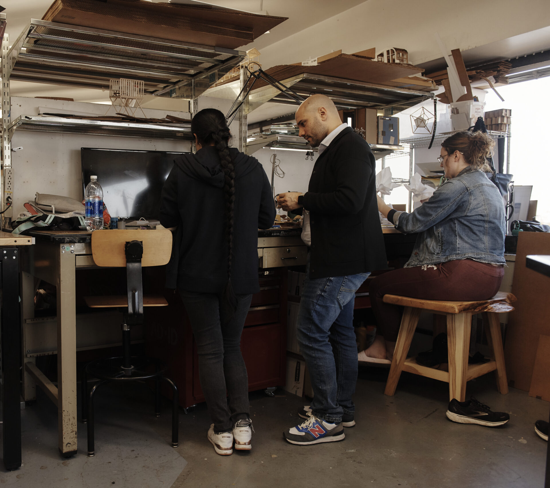 Students standing at desks in the Architecture department