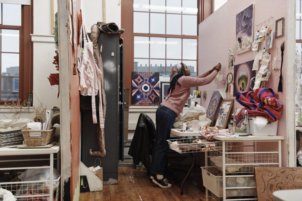 A student working in her studio space