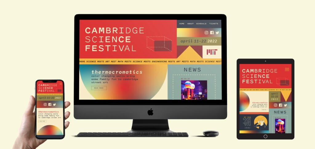 An apple computer with a colorful website design on the screen for the Cambridge Science Festival.