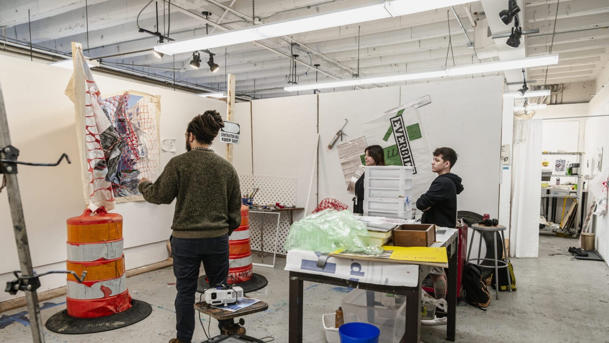 Students convene in a graduate studio space