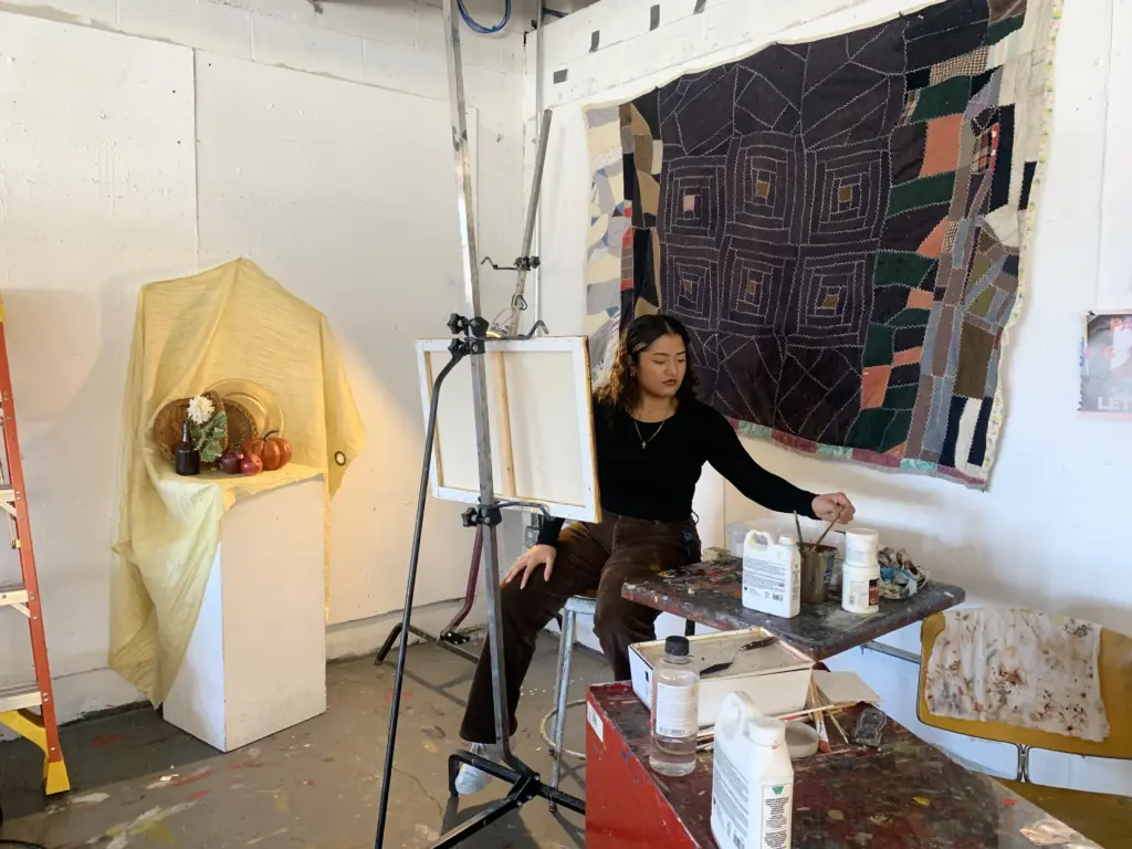 Gaby Moreno ‘25 BFA Painting, working in her studio.