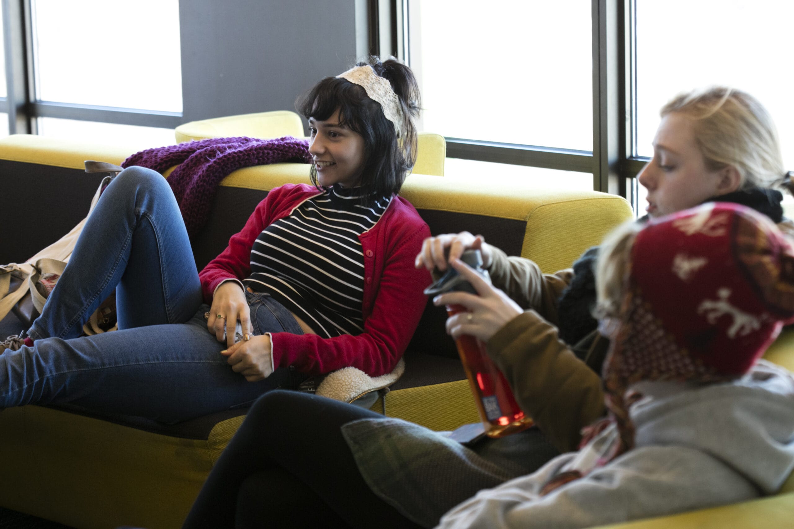 Students gather in the floor lounge of MassArt's Tree House residence hall.