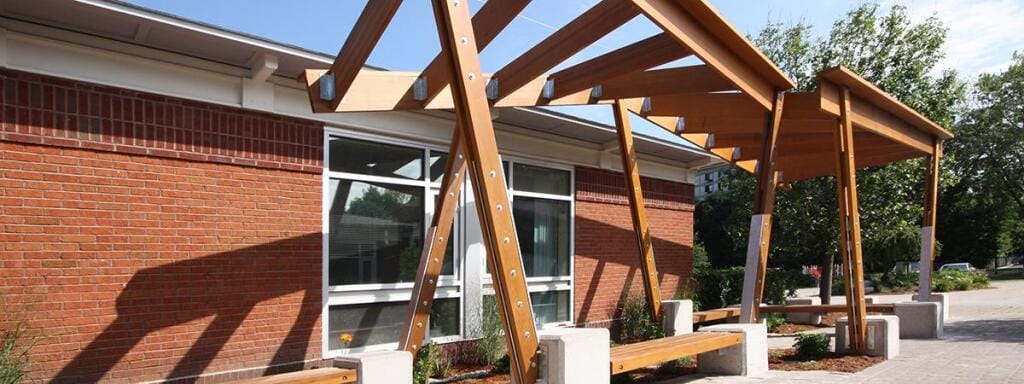 Wooden overhang on a brick building