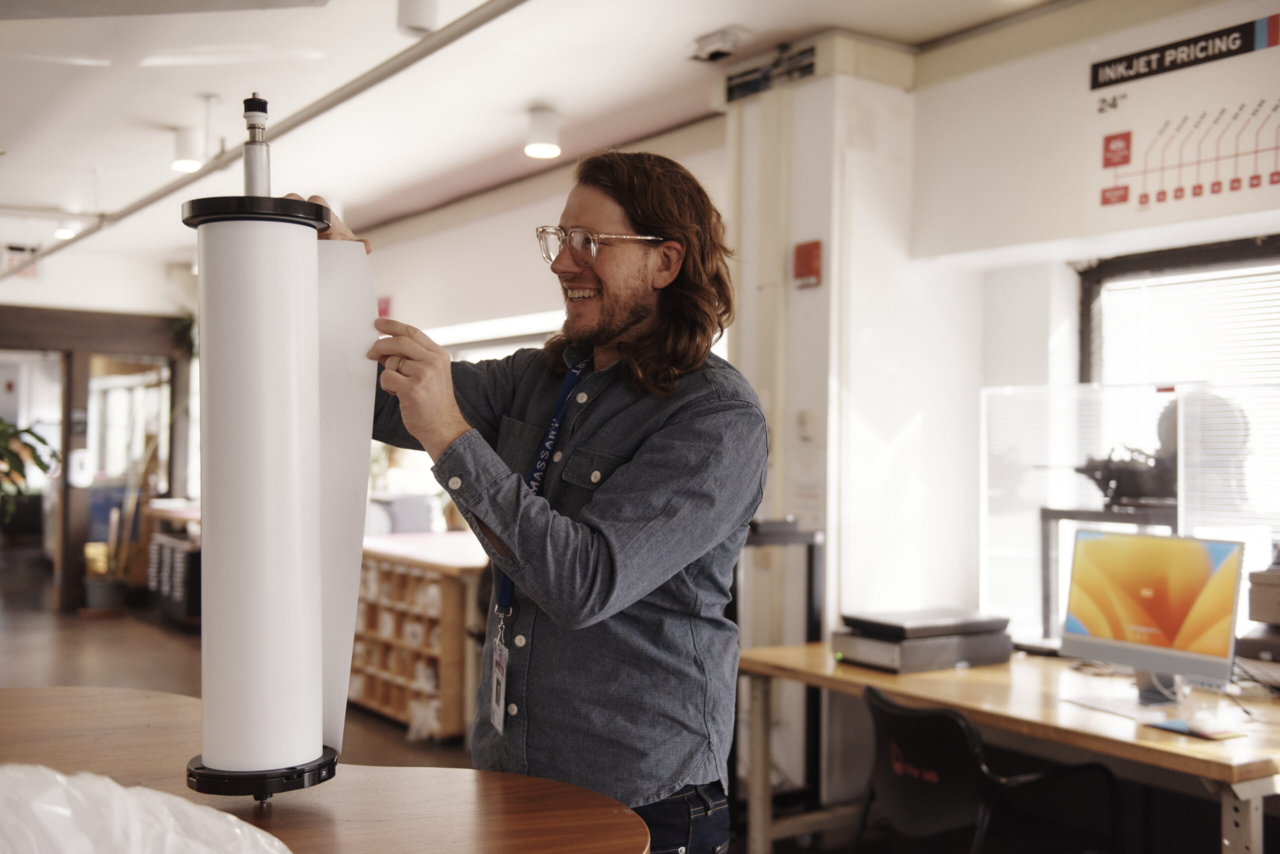 Clint Baclawski restocks printing supplies in The Lab. Photo: Tony Luong.