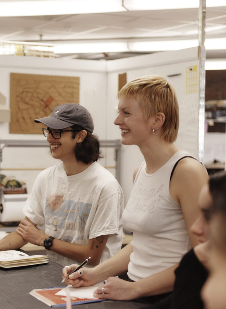 Students working in the Architecture department on the 10th floor of the Tower Building, with faculty members Paul Hajian & Patti Seitz.