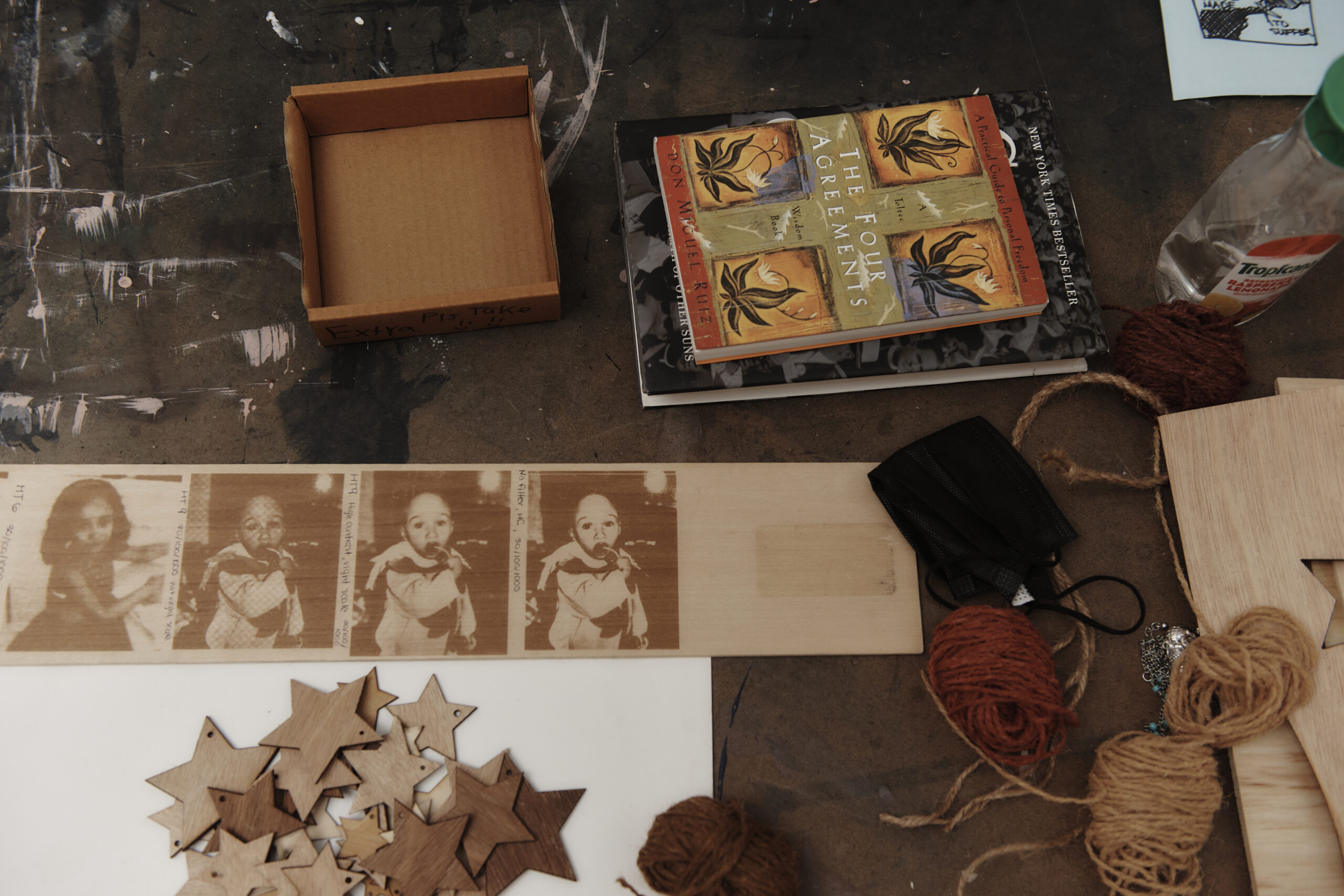 A close up of art-making materials on a table.