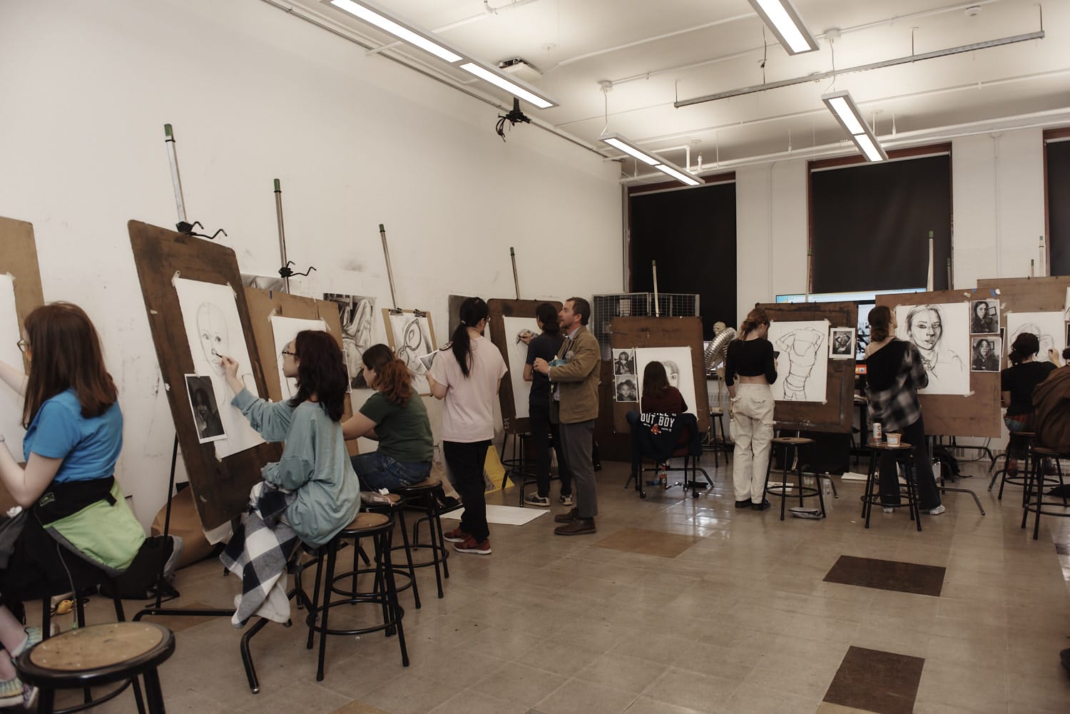 students painting during a lecture