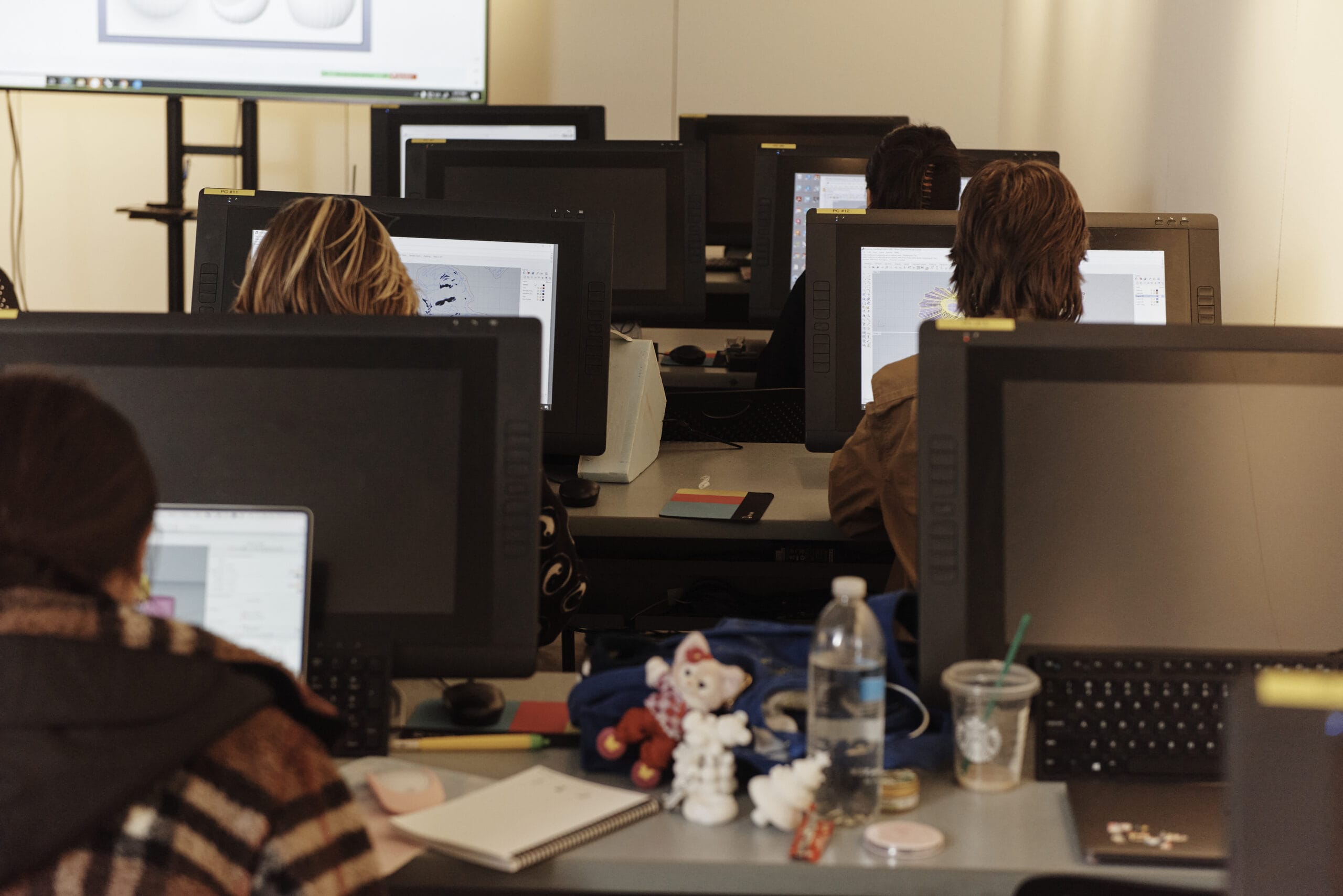 students in a lab looking at computer monitors