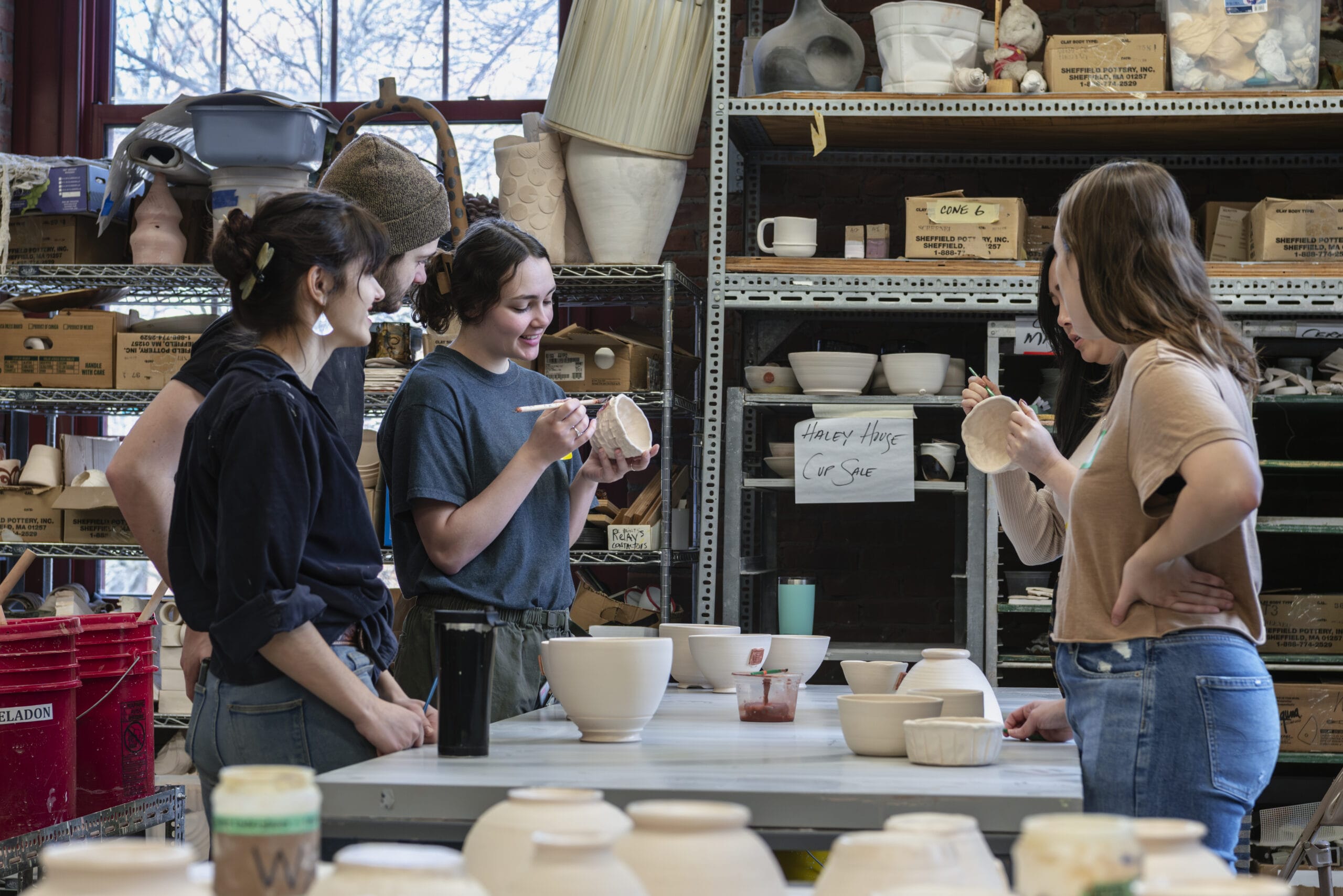 Students glazing bowls