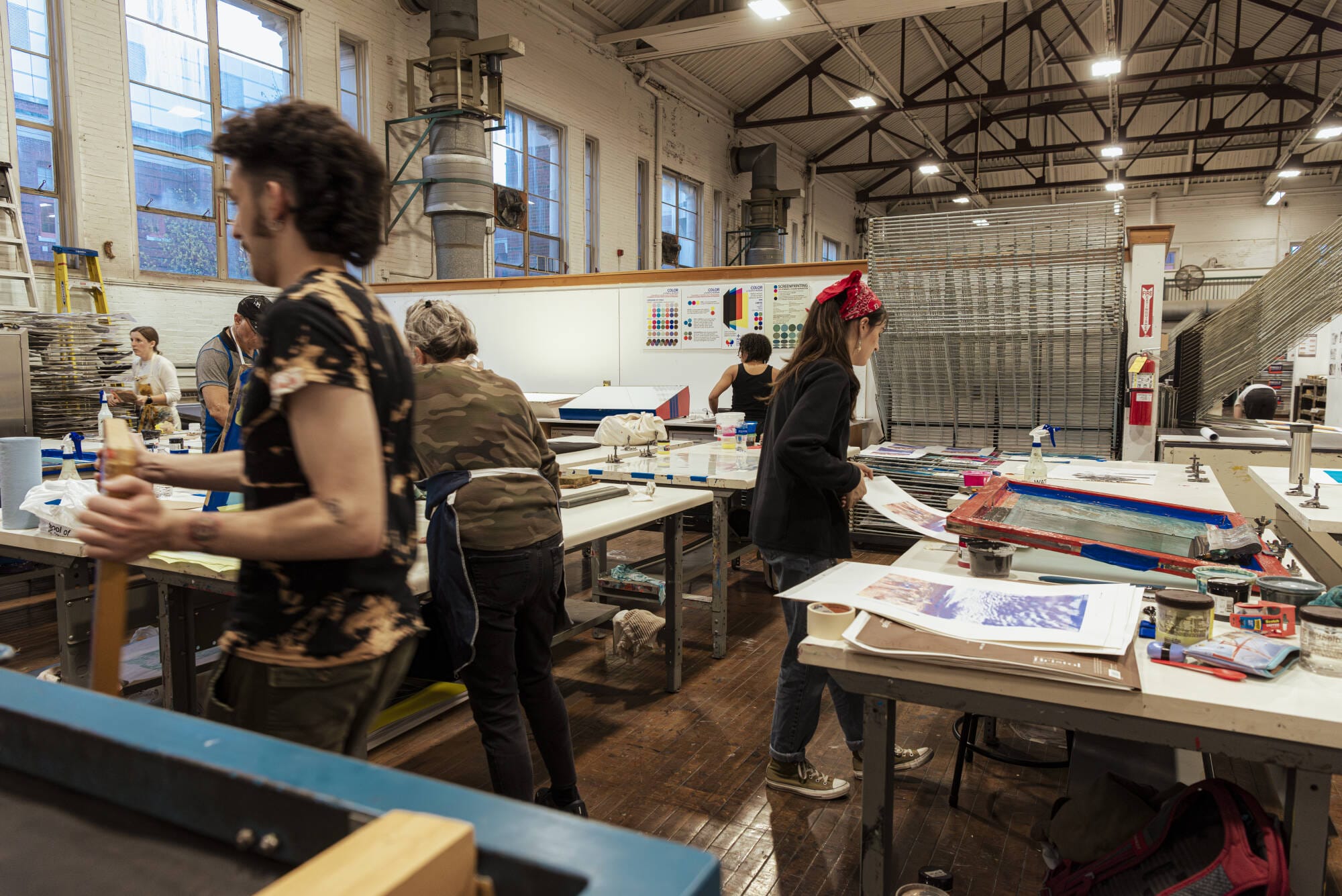 Students working in the Silkscreening area of MassArt's Print Studio/Print Shop