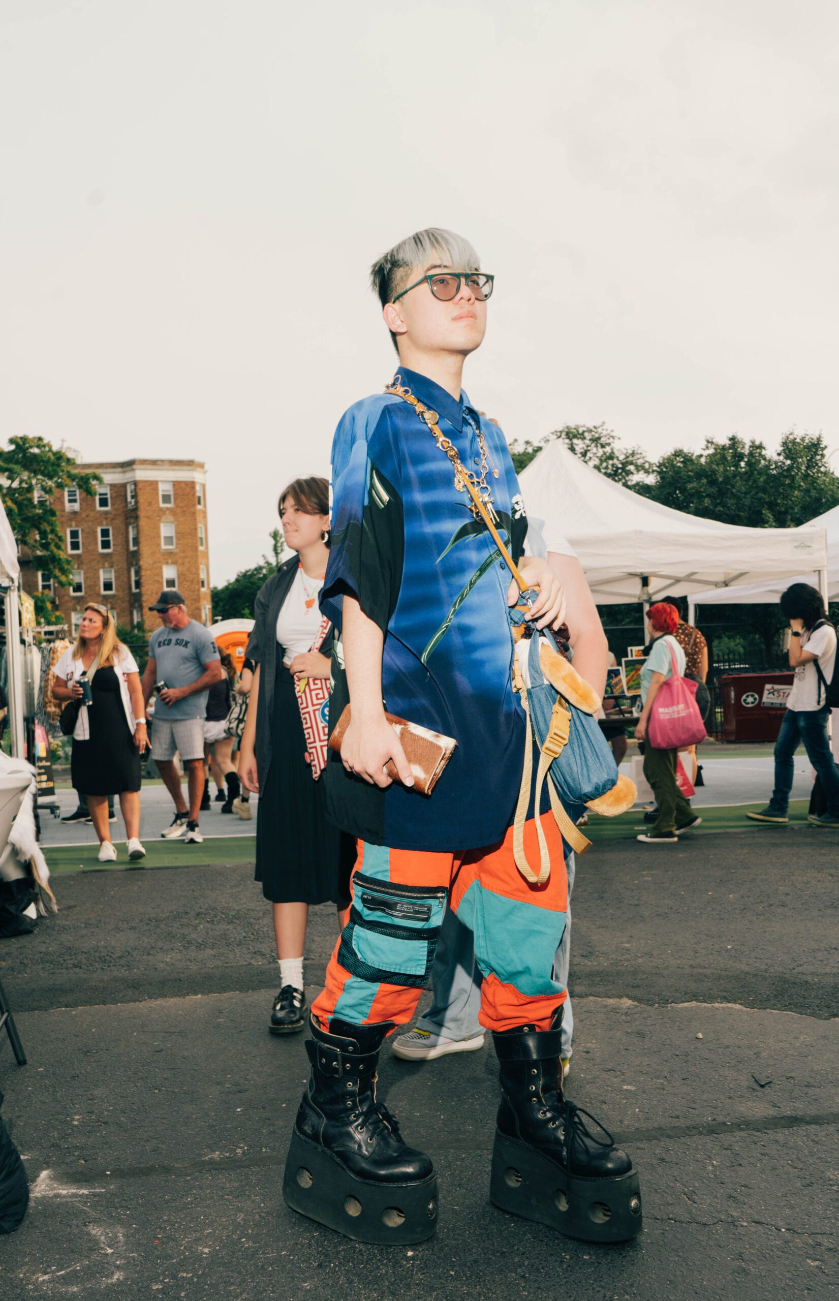 A student poses in platform boots at the MassArt Night Market