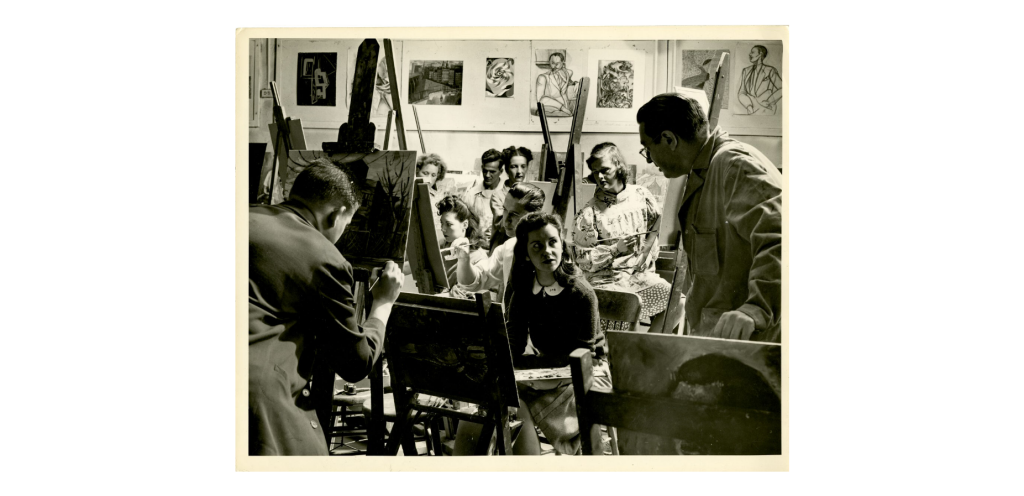 Mid-1900's black and photo photo of students painting at easels