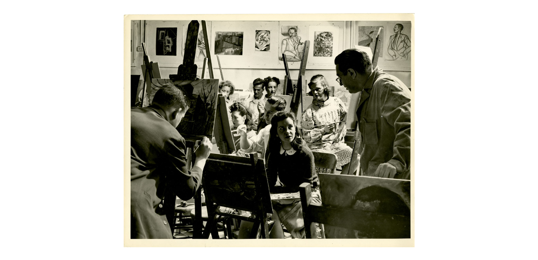 Mid-1900's black and photo photo of students painting at easels