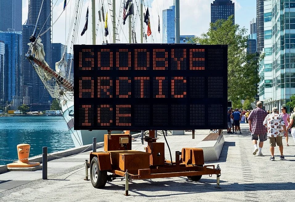 "Goodbye Arctic Ice" written on a hazard sign in the seaport