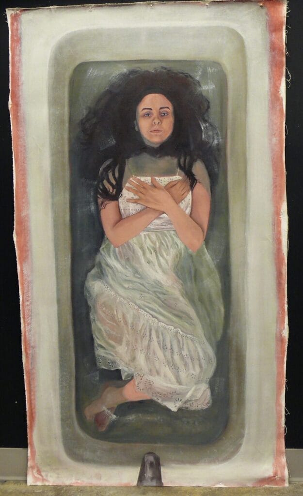 The painting depicts a woman lying in a bathtub with water, wearing a white dress reminiscent of baptism. Her long dark hair spreads around her, and she crosses her arms over her chest. The artwork, evoking the solemnity of fall, is on an unframed canvas with a black background.