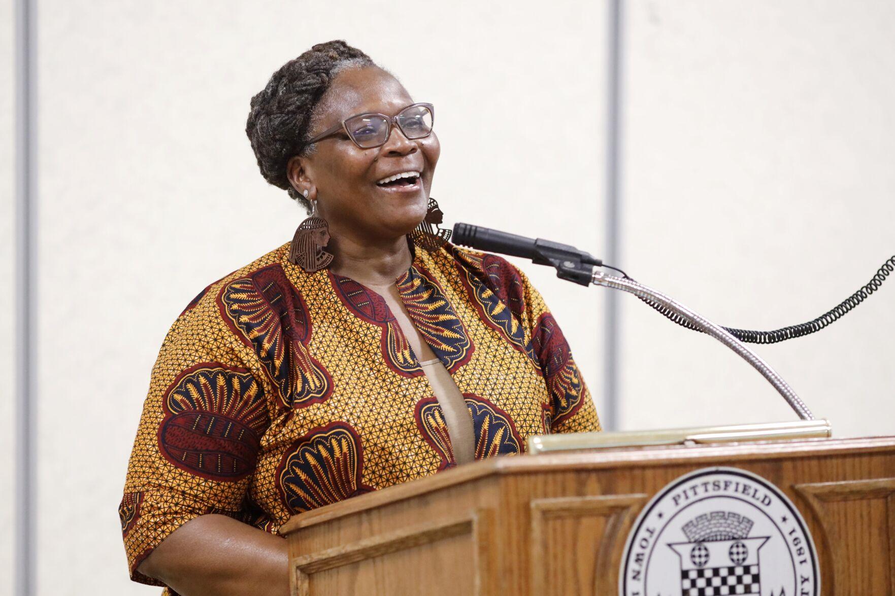 Woman speaks at podium