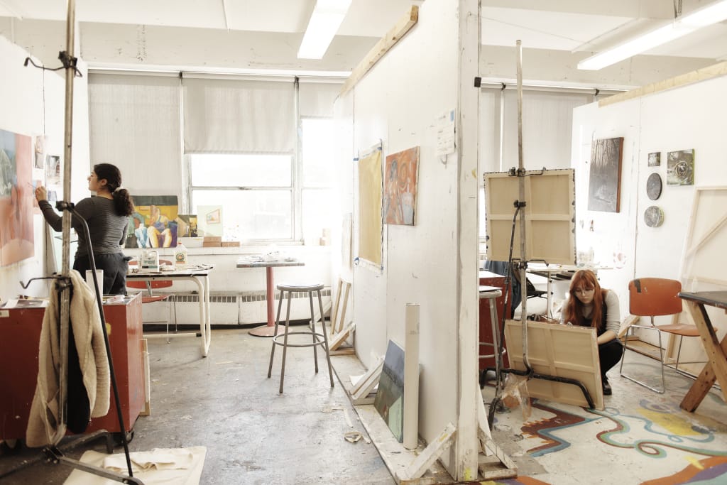 People painting segmented by wall