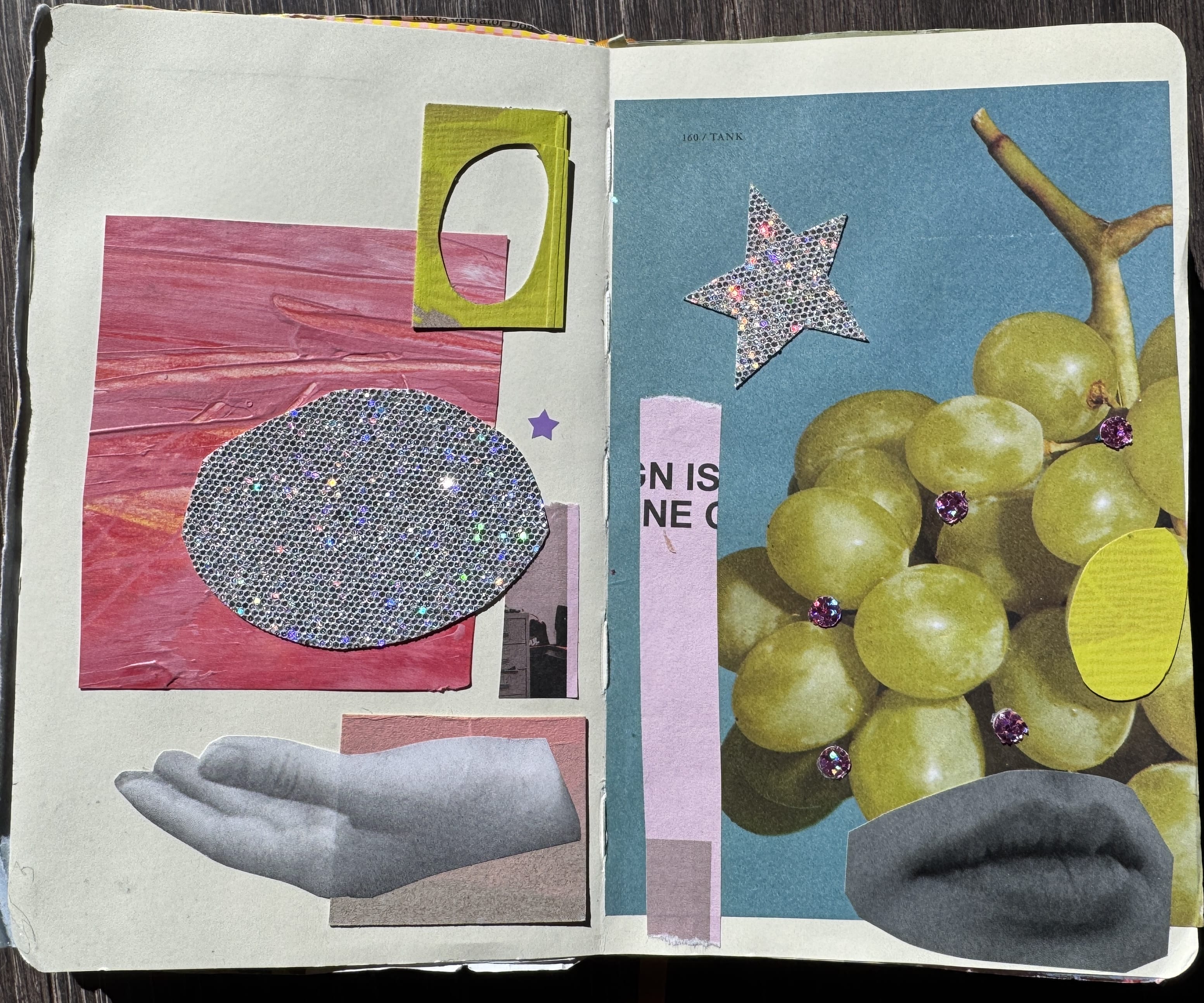 A mixed media collage in an open notebook explores visual boundaries, featuring green grapes, a sparkly star, a gray cutout of lips, a grayscale hand, abstract pink shapes, and a glittery oval on layered paper backgrounds.