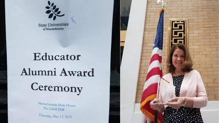 A MassArt Alum and Art Educator holds an award beside an American flag. Next to her is a sign reading Educator Alumni Award Ceremony, State Universities of Massachusetts, with event details at the MA Statehouse.