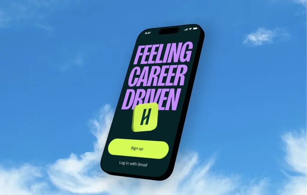 A smartphone floats against a blue sky with clouds, displaying a screen that reads FEELING CAREER DRIVEN in large purple text. Below is a green button labeled Sign up and an icon with the letter H.